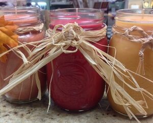 Photo of pint sized canning jar candles with soy wax and decorations