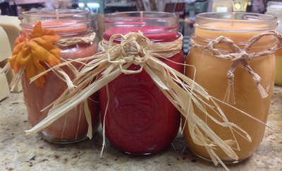 Photo of pint sized canning jar candles with soy wax and decorations